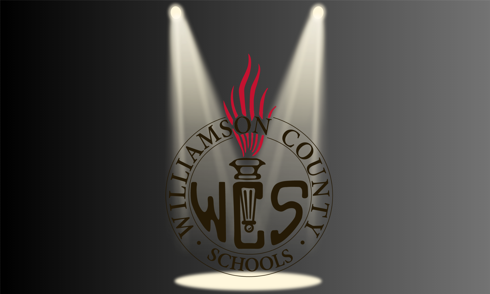 WCS logo under spotlight